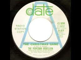 Popcorn Rebellion : The Christmas Game (7", Advance, Single, Promo, Pit)